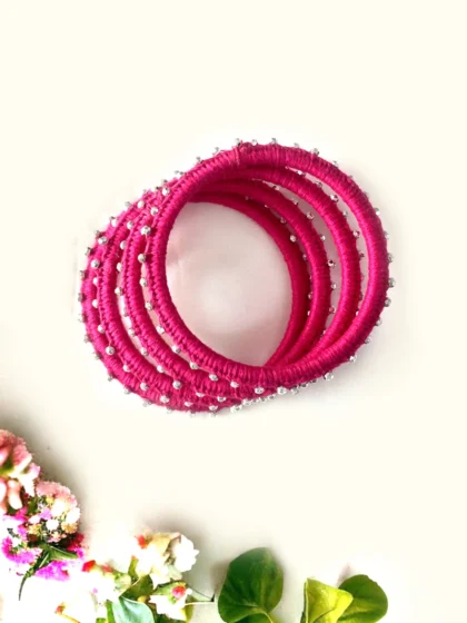 pink thread bangles with silver beads